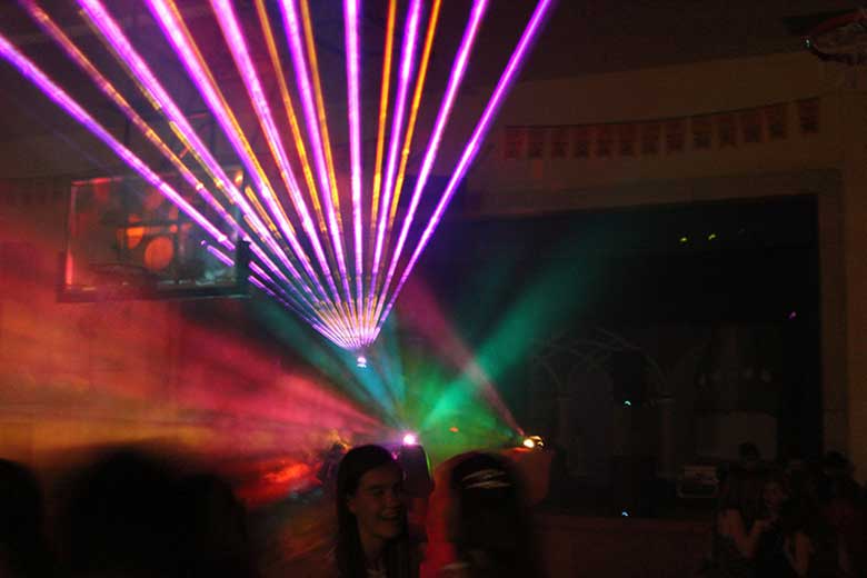 School Laser Light Show, Ancaster DJ, School dance with fan of orange & purple beams coming from the laser light show. Taken in Ancaster Ontario.